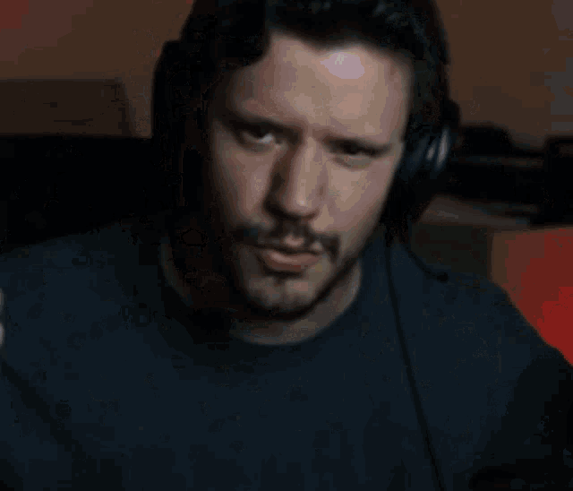 a man wearing headphones is surrounded by confetti falling from the sky