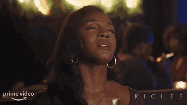 a woman with her eyes closed says thank god