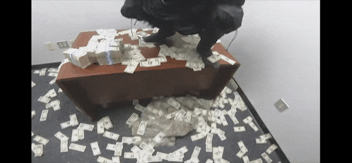 a stack of twenty dollar bills on a table