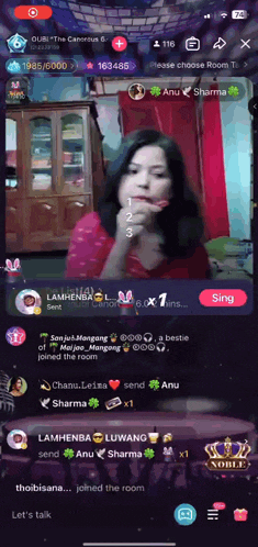 a screenshot of a noble app shows a girl singing
