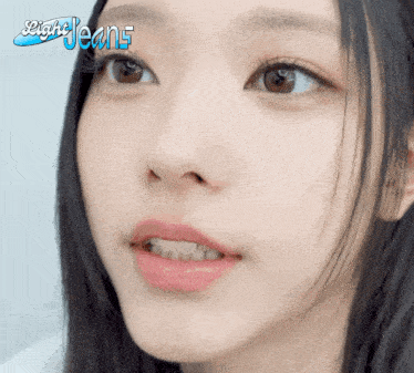 a close up of a woman 's face with light jeans written on the bottom right