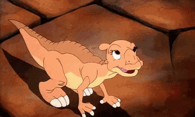 a cartoon lizard is standing on a rocky surface and smiling