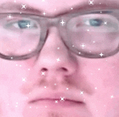 a close up of a man wearing glasses with a pink background and stars .