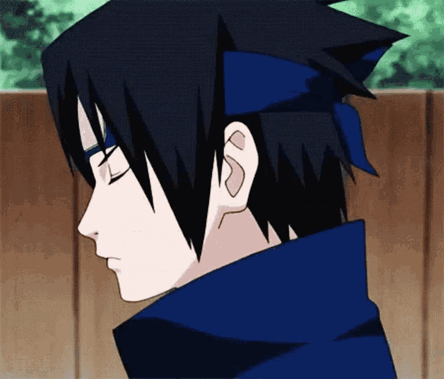 a close up of a person 's face with their eyes closed and a blue headband around their head .