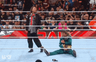 wrestlers in a wrestling ring with the word usa on the bottom
