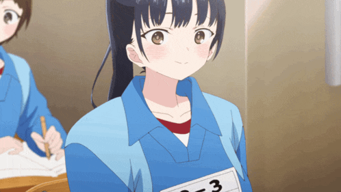 a girl in a blue shirt has a number 3 on her chest