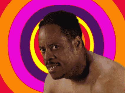 a shirtless man is standing in front of a colorful swirl