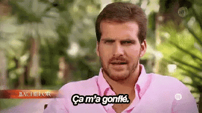 a man in a pink shirt says ca m 'a gonfle