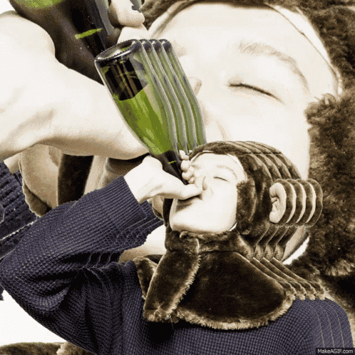 a person wearing a monkey costume is drinking from a bottle