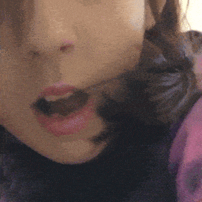 a close up of a person 's mouth with a pink lip