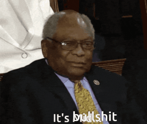 a man in a suit and tie says it 's bullshit in white letters