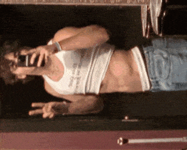 a man is taking a selfie in front of a mirror