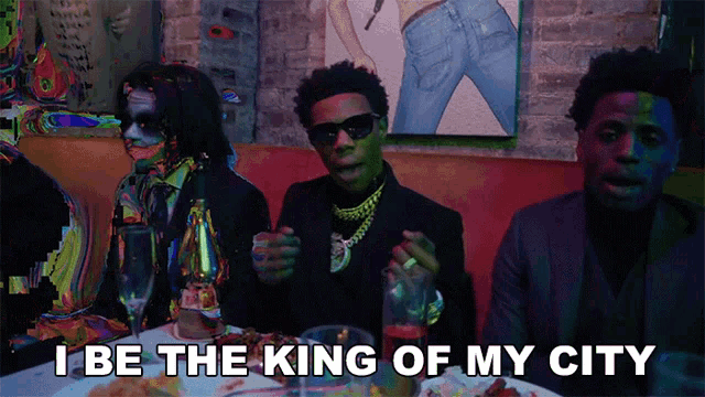 a group of men sitting at a table with the words " i be the king of my city " on the bottom