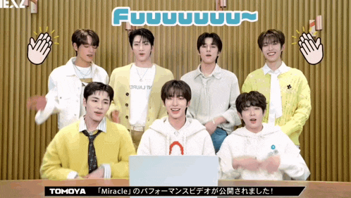 a group of young men are standing in front of a sign that says fuuuuuuuu