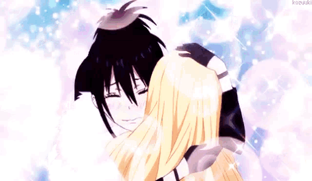 a boy and a girl are hugging each other .