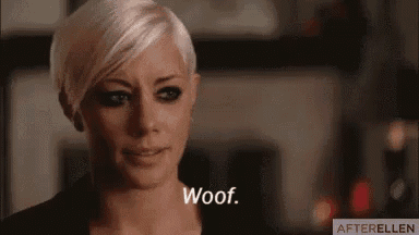a woman with short blonde hair is making a funny face and says woof .
