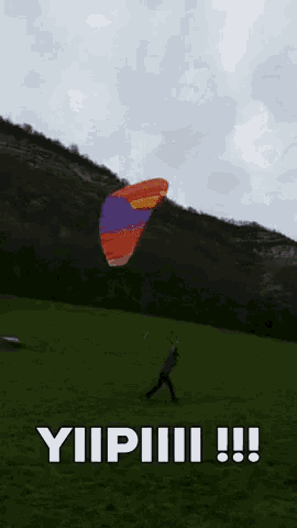 a person is flying a parachute in a grassy field with the words yipiii !!! below it