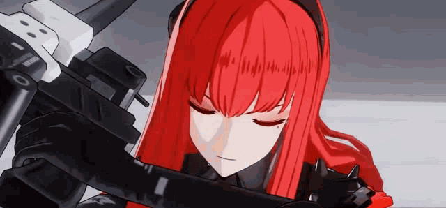 a girl with red hair is holding a gun .