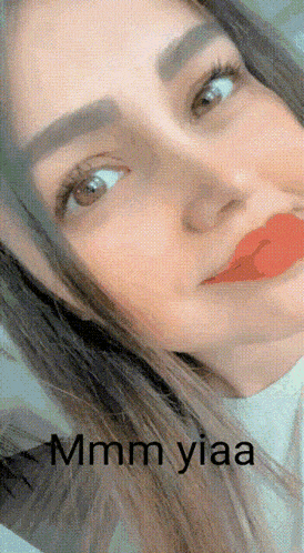 a close up of a woman 's face with the words " mmmm yiaa " below it