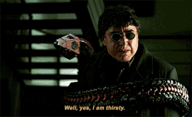 a man wearing sunglasses and a black coat says well yes i am thirsty