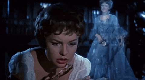 a woman in a white dress is standing in front of a ghost