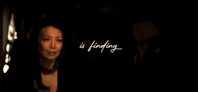 a close up of a man 's face with the words `` is finding '' written on it .