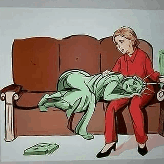 a woman is sitting on a couch with a statue of liberty laying on the couch .