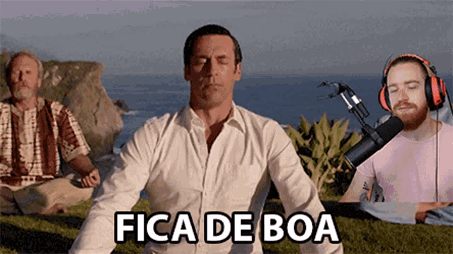 a man sits in a lotus position in front of a microphone with the words fica de boa written below him