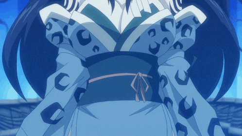 a woman in a blue and white kimono with a black belt