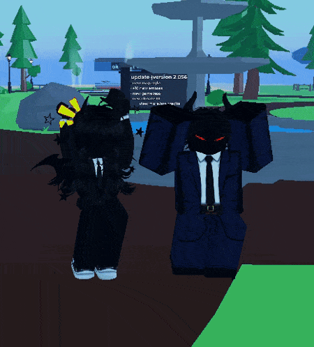 a person in a suit and tie standing next to another person