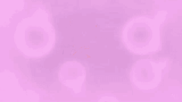 a man wearing glasses is smiling in front of a purple background with pink circles and stars .