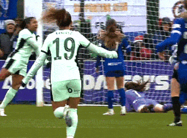 a female soccer player with the number 19 on her back