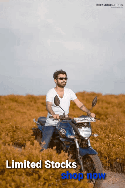 a man on a motorcycle with the words limited stocks shop now