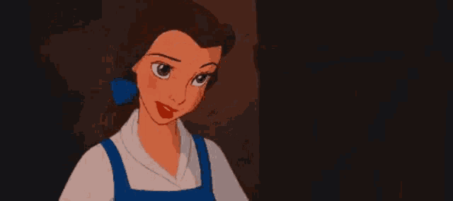 belle is a cartoon character from beauty and the beast holding a book .