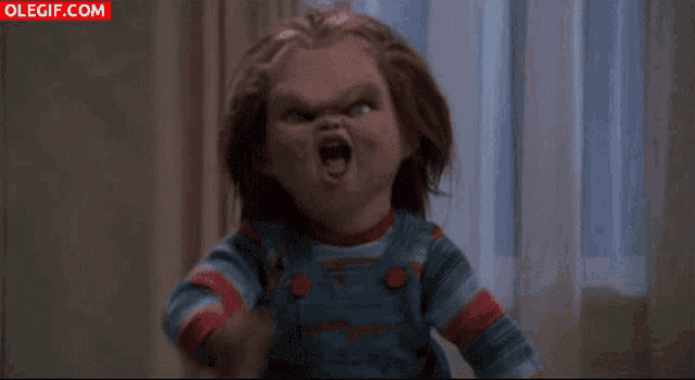 a creepy doll is screaming with the website olegif.com visible in the corner