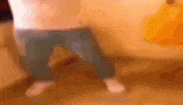 a blurry picture of a person 's legs and pants