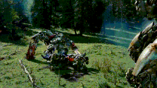 a transformer is laying on the ground in a grassy field