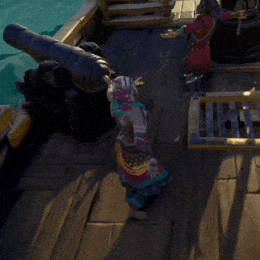 a man in a pirate outfit is standing on a wooden deck