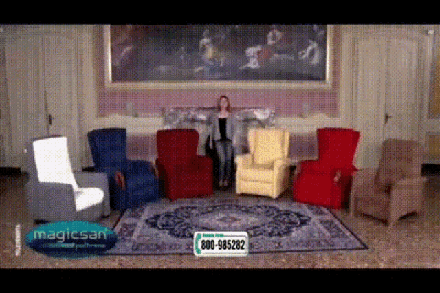 a woman stands in a living room surrounded by chairs and a sign that says magicsan on it