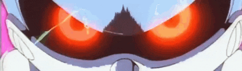a close up of a cartoon character 's face with red eyes .