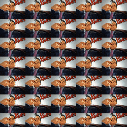 a repeating pattern of images of a man in a suit and tie with the word love in the background