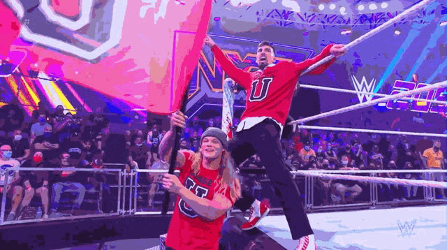 a man in a red shirt with the letter u on the front