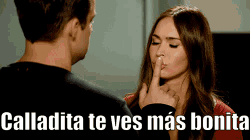 a woman is covering her mouth with her finger and the words calladita te ves mas bonita are above her
