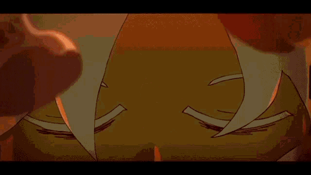 a close up of a cartoon character 's face with red eyes holding a piece of paper .