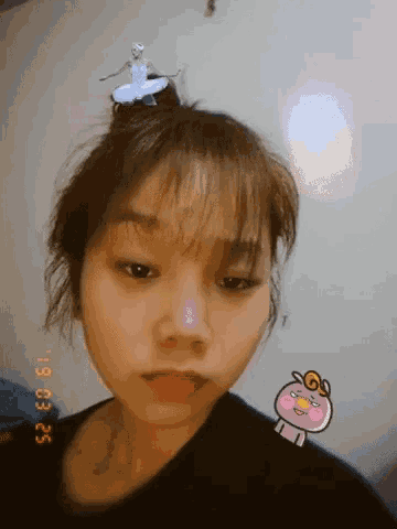 a girl with a ballerina on top of her head and the date 19 03 25 on the bottom right