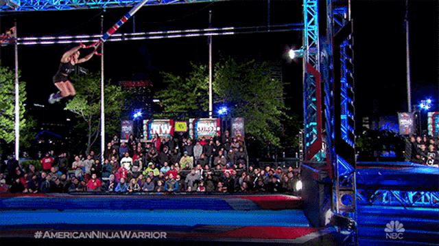 a nbc advertisement for american ninja warrior shows a man jumping over a fence