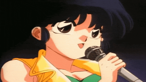 a cartoon girl singing into a microphone with her tongue out