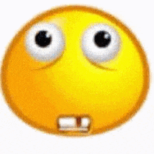 a close up of a yellow smiley face with big eyes and a mouth .