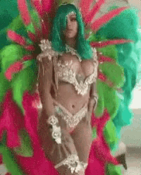 a woman in a colorful costume is standing in front of a colorful background .
