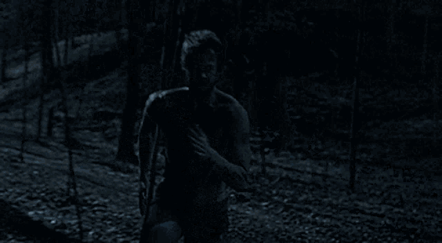a person 's legs are visible in the dark